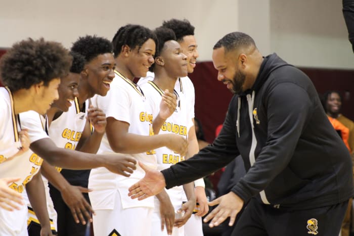 King/Drew coach Lloyd Webster celebrates with his team after beating LACES in the LA City Section Open Division final at Pasadena City College on Saturday, Feb. 24, 2024.